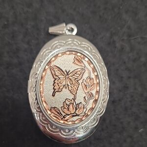 Silver-plated diamond-cut copper photo locket with a butterfly and flower design